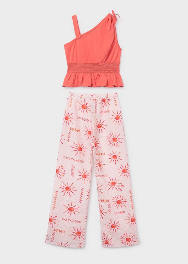 Conjunto de dos piezas con top de nido de abeja y pantalón fluido con estampado solar